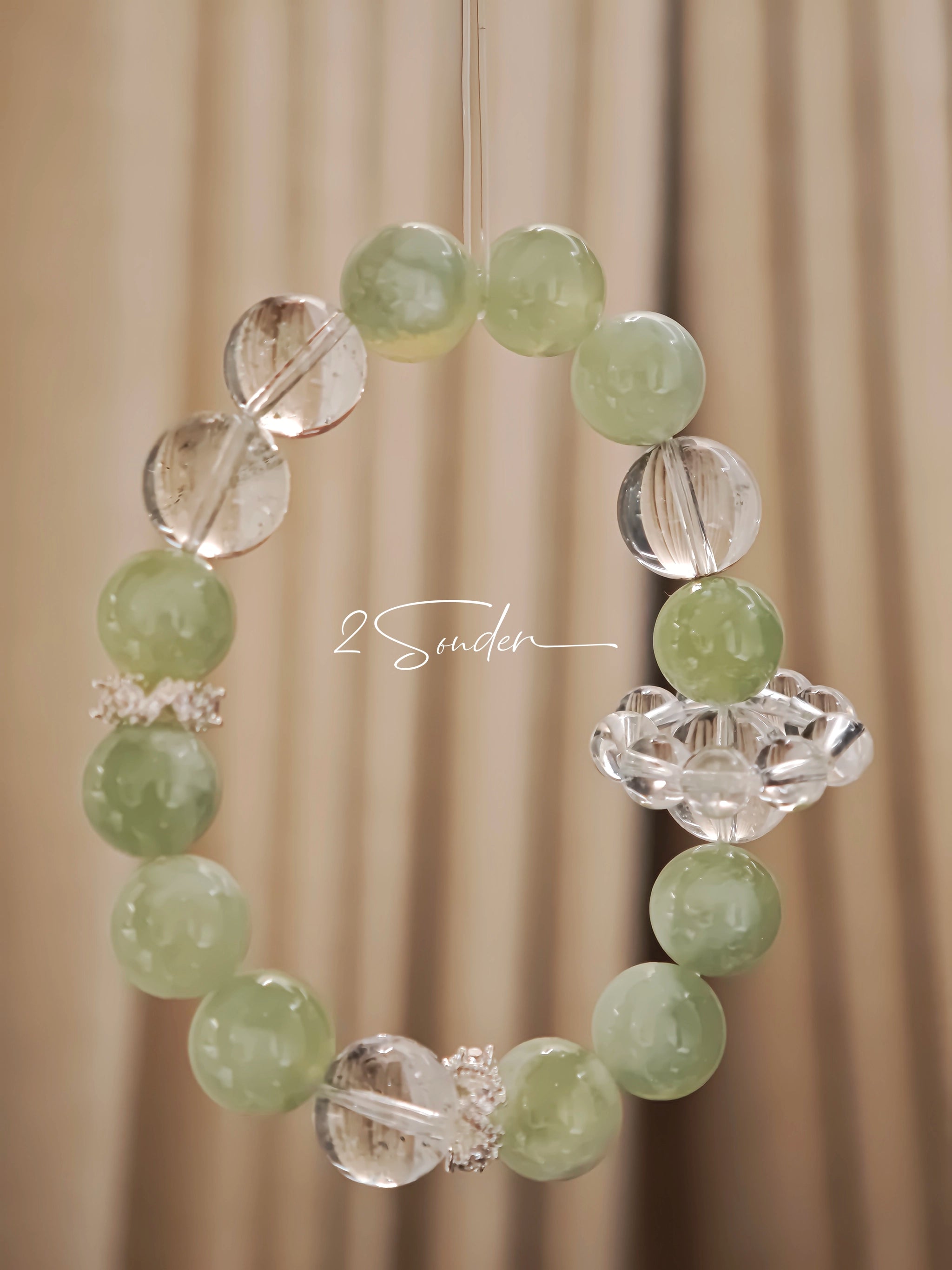 This is a bracelet consists of Xiuyan (Serpentine) Jade, Green Phantom Quartz, Clear Quartz, and 925 sterling silver accents, this gemstone bracelet blends timeless elegance with spiritual meaning.