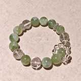This is a bracelet consists of Xiuyan (Serpentine) Jade, Green Phantom Quartz, Clear Quartz, and 925 sterling silver accents, this gemstone bracelet blends timeless elegance with spiritual meaning.