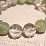 This is a bracelet consists of Xiuyan (Serpentine) Jade, Green Phantom Quartz, Clear Quartz, and 925 sterling silver accents, this gemstone bracelet blends timeless elegance with spiritual meaning.