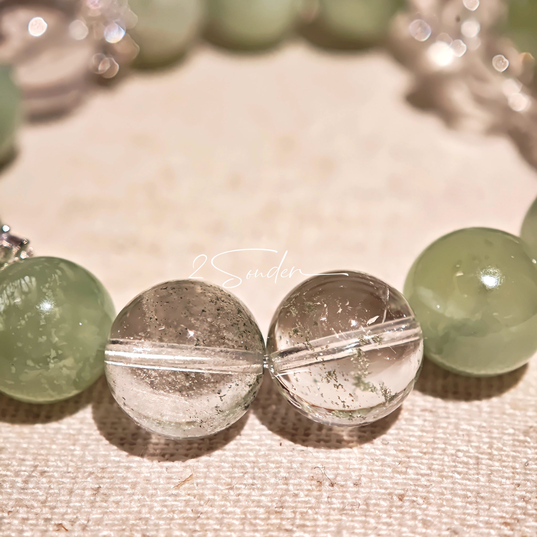 This is a bracelet consists of Xiuyan (Serpentine) Jade, Green Phantom Quartz, Clear Quartz, and 925 sterling silver accents, this gemstone bracelet blends timeless elegance with spiritual meaning.