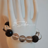 This is a bracelet consists of silver sheen obsidian, clear quartz, herkimer diamonds, meteorite and edgy accents.
