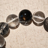 This is a bracelet consists of silver sheen obsidian, clear quartz, herkimer diamonds, meteorite and edgy accents.