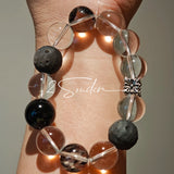 This is a bracelet consists of silver sheen obsidian, clear quartz, herkimer diamonds, meteorite and edgy accents.