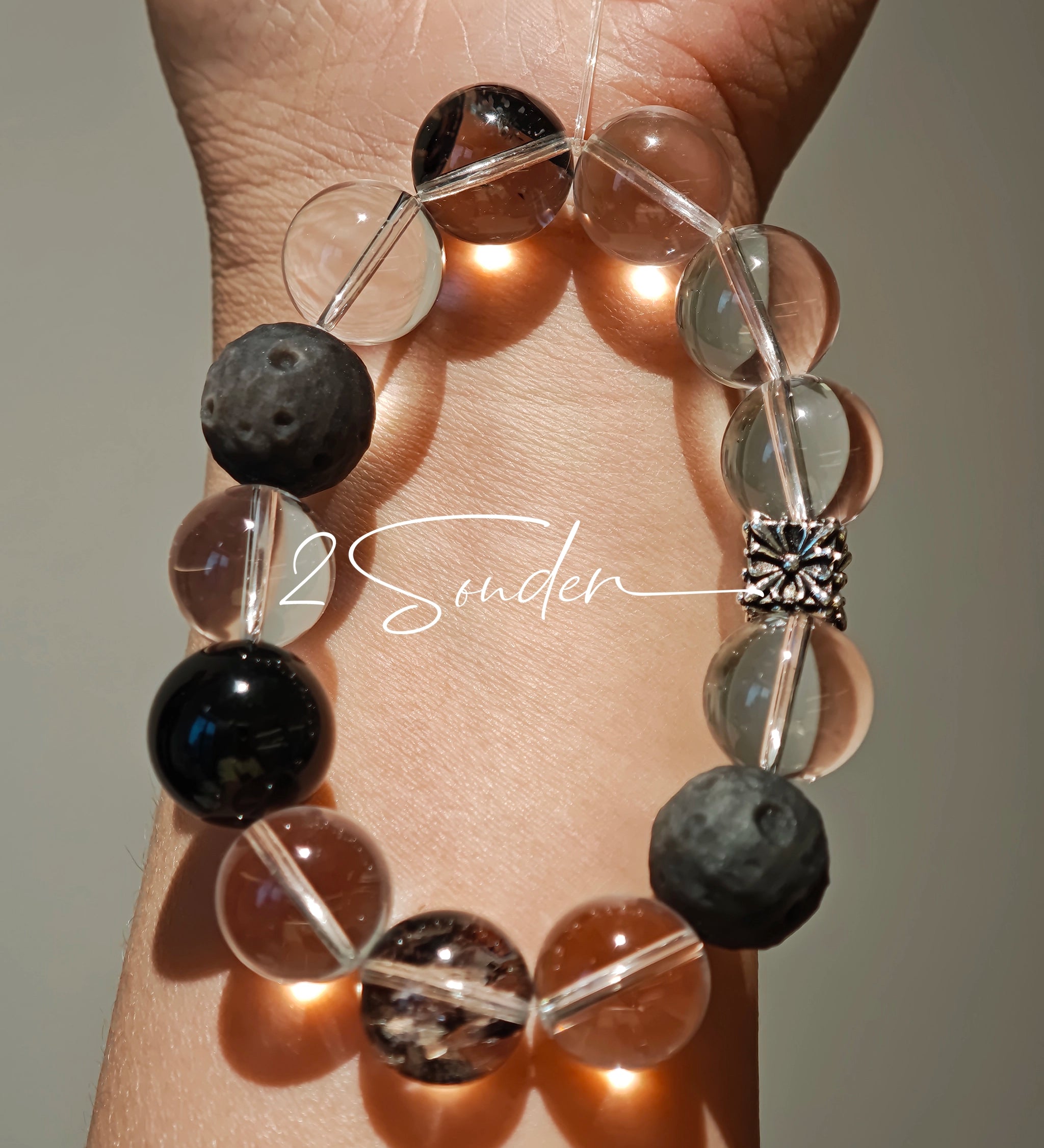 This is a bracelet consists of silver sheen obsidian, clear quartz, herkimer diamonds, meteorite and edgy accents.