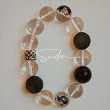 This is a bracelet consists of silver sheen obsidian, clear quartz, herkimer diamonds, meteorite and edgy accents.