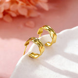 These sterling silver stud earrings are inspired by the natural, smooth folds of tin foil. Their surface texture resembles the wrinkles on tin foil, presenting a stunning sheen. The simple yet stylish design makes them versatile and practical, easily adding a touch of modern fashion to your everyday outfits.