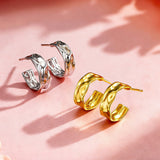 These sterling silver stud earrings are inspired by the natural, smooth folds of tin foil. Their surface texture resembles the wrinkles on tin foil, presenting a stunning sheen. The simple yet stylish design makes them versatile and practical, easily adding a touch of modern fashion to your everyday outfits.