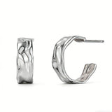 These sterling silver stud earrings are inspired by the natural, smooth folds of tin foil. Their surface texture resembles the wrinkles on tin foil, presenting a stunning sheen. The simple yet stylish design makes them versatile and practical, easily adding a touch of modern fashion to your everyday outfits.