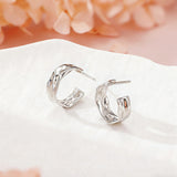 These sterling silver stud earrings are inspired by the natural, smooth folds of tin foil. Their surface texture resembles the wrinkles on tin foil, presenting a stunning sheen. The simple yet stylish design makes them versatile and practical, easily adding a touch of modern fashion to your everyday outfits.