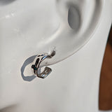 These sterling silver stud earrings are inspired by the natural, smooth folds of tin foil. Their surface texture resembles the wrinkles on tin foil, presenting a stunning sheen. The simple yet stylish design makes them versatile and practical, easily adding a touch of modern fashion to your everyday outfits.
