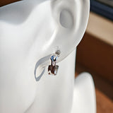 These sterling silver stud earrings are inspired by the natural, smooth folds of tin foil. Their surface texture resembles the wrinkles on tin foil, presenting a stunning sheen. The simple yet stylish design makes them versatile and practical, easily adding a touch of modern fashion to your everyday outfits.