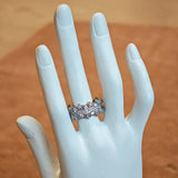 This snowflake zircon open ring features an intricate and textured band, adorned with clusters of sparkling zircon stones that mimic delicate snowflakes. Its adjustable open design ensures a comfortable fit, while the polished copper alloy metal reflects light beautifully, creating an elegant, frosty aesthetic. The detailed craftsmanship gives it a luxurious, eye-catching appearance ideal for adding a wintry charm to any look.