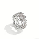 This snowflake zircon open ring features an intricate and textured band, adorned with clusters of sparkling zircon stones that mimic delicate snowflakes. Its adjustable open design ensures a comfortable fit, while the polished copper alloy metal reflects light beautifully, creating an elegant, frosty aesthetic. The detailed craftsmanship gives it a luxurious, eye-catching appearance ideal for adding a wintry charm to any look.
