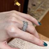 This snowflake zircon open ring features an intricate and textured band, adorned with clusters of sparkling zircon stones that mimic delicate snowflakes. Its adjustable open design ensures a comfortable fit, while the polished copper alloy metal reflects light beautifully, creating an elegant, frosty aesthetic. The detailed craftsmanship gives it a luxurious, eye-catching appearance ideal for adding a wintry charm to any look.