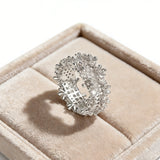This snowflake zircon open ring features an intricate and textured band, adorned with clusters of sparkling zircon stones that mimic delicate snowflakes. Its adjustable open design ensures a comfortable fit, while the polished copper alloy metal reflects light beautifully, creating an elegant, frosty aesthetic. The detailed craftsmanship gives it a luxurious, eye-catching appearance ideal for adding a wintry charm to any look.