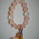 Blushing crystals flow into icy blue veins, topped with an amber star charm, sliding agate pearl, and graceful boho fringe.
