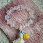 Soft romance meets mystic blue, finished by an amber star, agate traveler, and silky tassel for effortless gypsy chic.