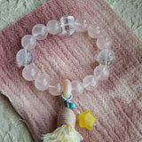 Soft romance meets mystic blue, finished by an amber star, agate traveler, and silky tassel for effortless gypsy chic.