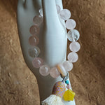 Pink serenity entwines with blue mystery, and an amber star, wandering agate, and feather-light tassel give it wanderlust soul.