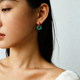 These summer candy-colored hoop earrings feature cute carved natural stone flower pendants paired with glossy enamel-coated metal hoops. They come in a vibrant palette of playful bright hues, creating a fresh, sweet and youthful summery style. The minimalist huggie hoop structure with delicate floral charms makes them lightweight and versatile for daily casual wear.