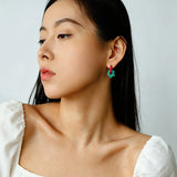 These summer candy-colored hoop earrings feature cute carved natural stone flower pendants paired with glossy enamel-coated metal hoops. They come in a vibrant palette of playful bright hues, creating a fresh, sweet and youthful summery style. The minimalist huggie hoop structure with delicate floral charms makes them lightweight and versatile for daily casual wear.