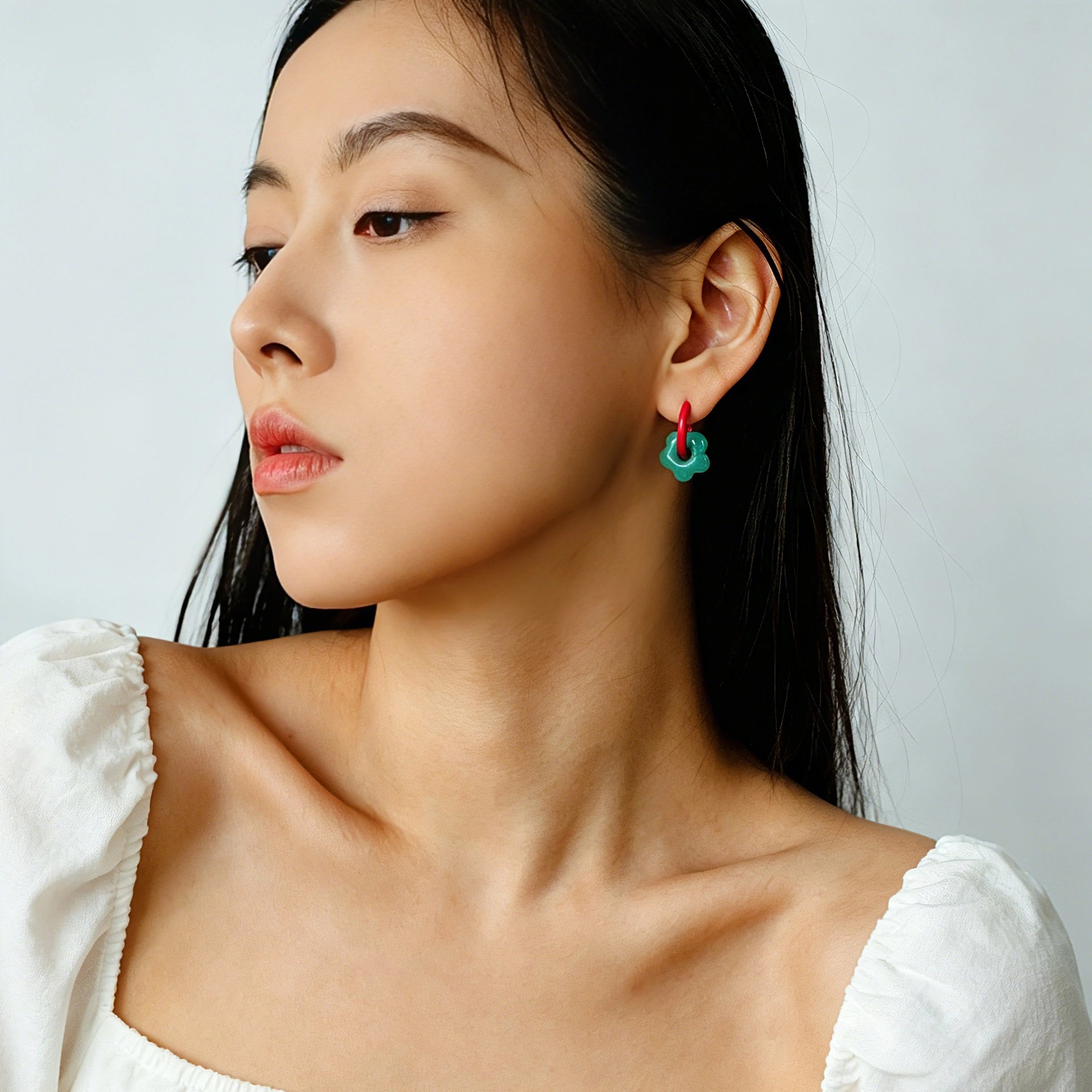 These summer candy-colored hoop earrings feature cute carved natural stone flower pendants paired with glossy enamel-coated metal hoops. They come in a vibrant palette of playful bright hues, creating a fresh, sweet and youthful summery style. The minimalist huggie hoop structure with delicate floral charms makes them lightweight and versatile for daily casual wear.