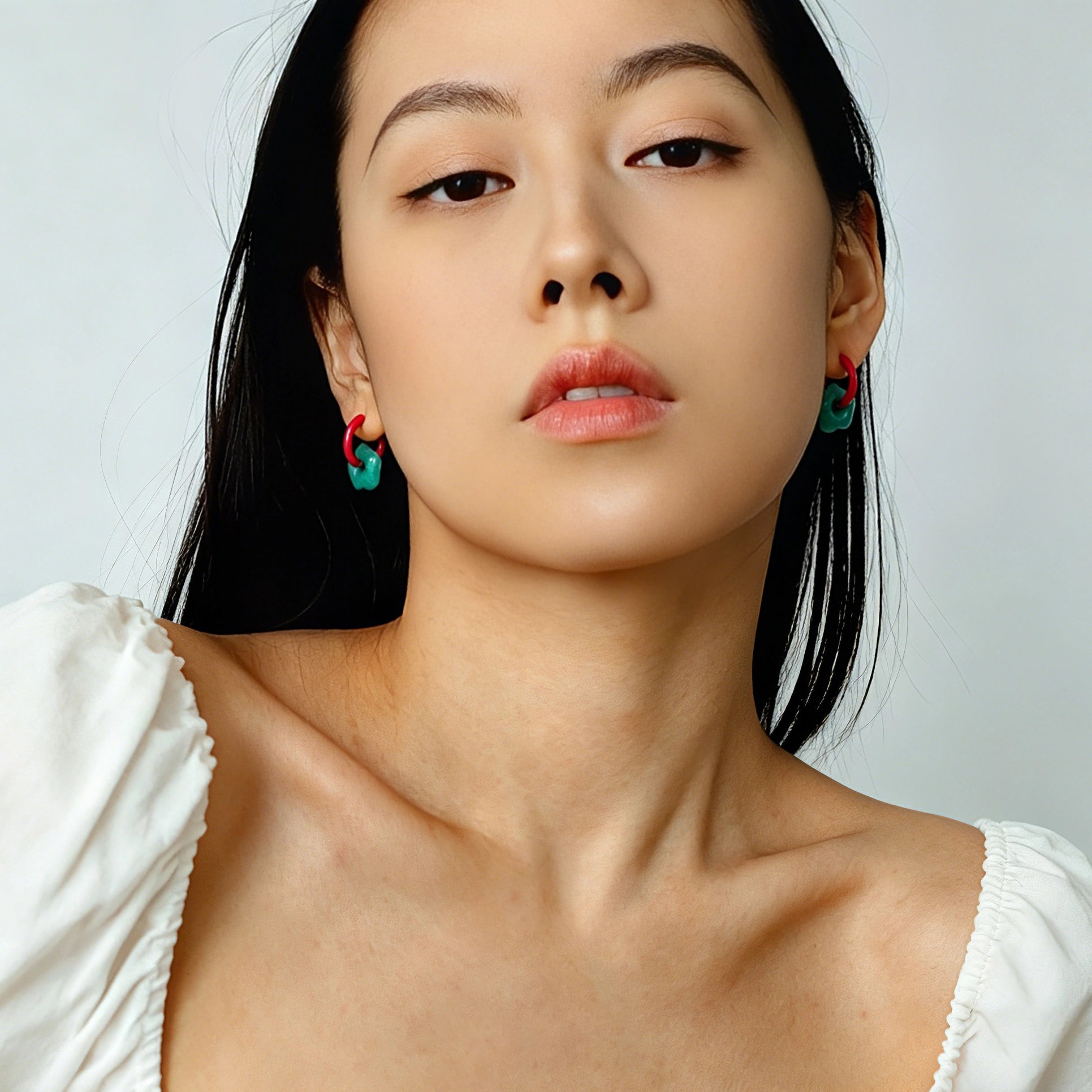 These summer candy-colored hoop earrings feature cute carved natural stone flower pendants paired with glossy enamel-coated metal hoops. They come in a vibrant palette of playful bright hues, creating a fresh, sweet and youthful summery style. The minimalist huggie hoop structure with delicate floral charms makes them lightweight and versatile for daily casual wear.