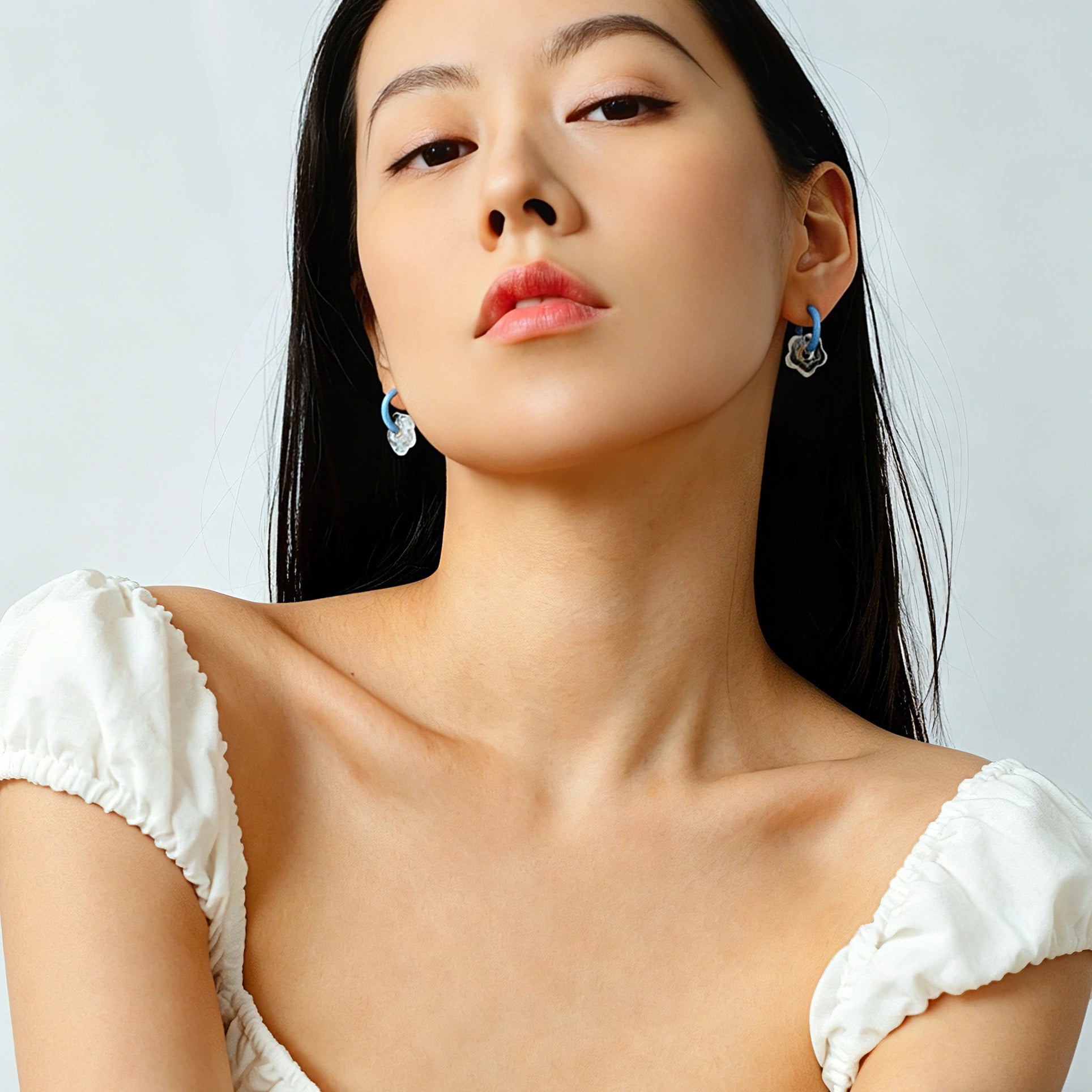 These summer candy-colored hoop earrings feature cute carved natural stone flower pendants paired with glossy enamel-coated metal hoops. They come in a vibrant palette of playful bright hues, creating a fresh, sweet and youthful summery style. The minimalist huggie hoop structure with delicate floral charms makes them lightweight and versatile for daily casual wear.