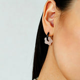These summer candy-colored hoop earrings feature cute carved natural stone flower pendants paired with glossy enamel-coated metal hoops. They come in a vibrant palette of playful bright hues, creating a fresh, sweet and youthful summery style. The minimalist huggie hoop structure with delicate floral charms makes them lightweight and versatile for daily casual wear.