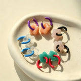 These summer candy-colored hoop earrings feature cute carved natural stone flower pendants paired with glossy enamel-coated metal hoops. They come in a vibrant palette of playful bright hues, creating a fresh, sweet and youthful summery style. The minimalist huggie hoop structure with delicate floral charms makes them lightweight and versatile for daily casual wear.