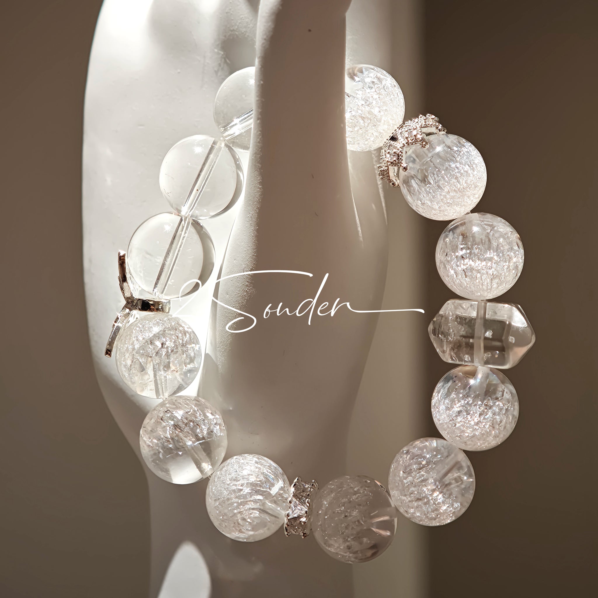 This is a crystal bracelet including white fireworks super seven clear quartzs, pure clear quartzs and raw clear quartz nuggets.