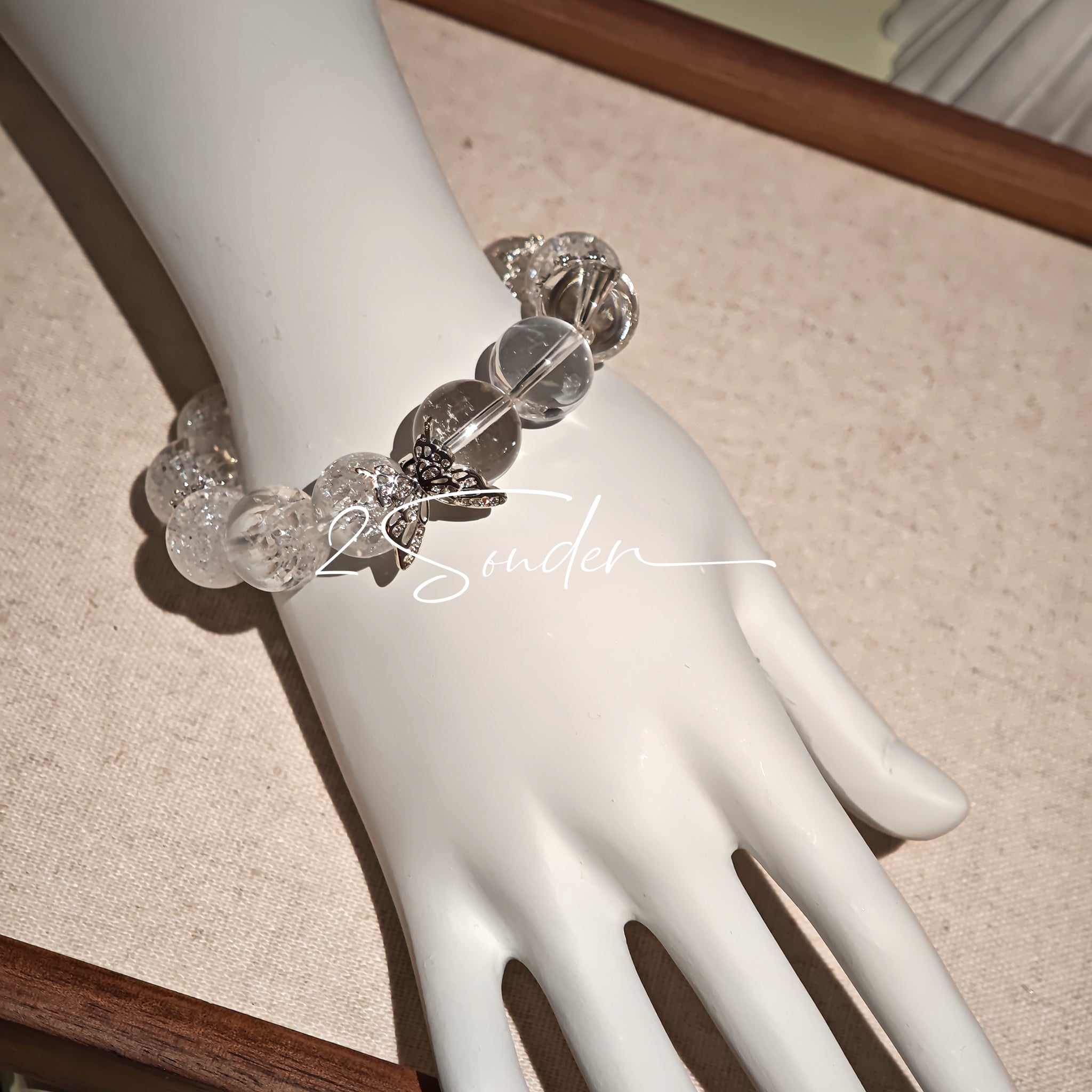 This is a crystal bracelet including white fireworks super seven clear quartzs, pure clear quartzs and raw clear quartz nuggets.
