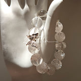 This is a crystal bracelet including white fireworks super seven clear quartzs, pure clear quartzs and raw clear quartz nuggets.