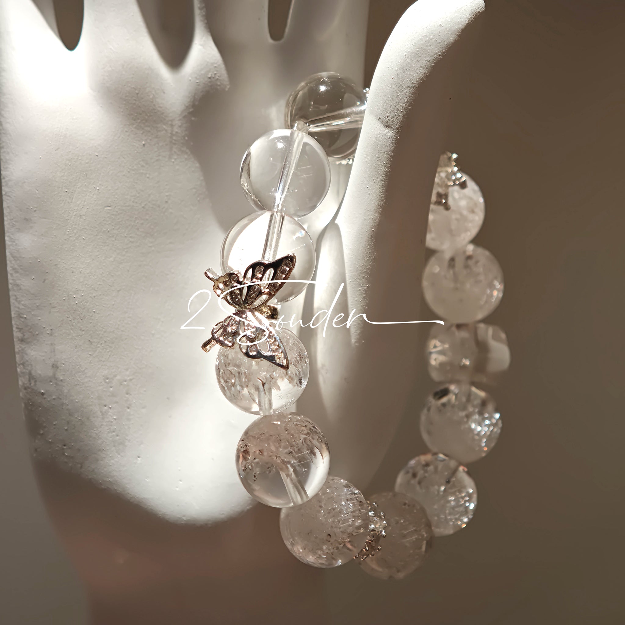 This is a crystal bracelet including white fireworks super seven clear quartzs, pure clear quartzs and raw clear quartz nuggets.
