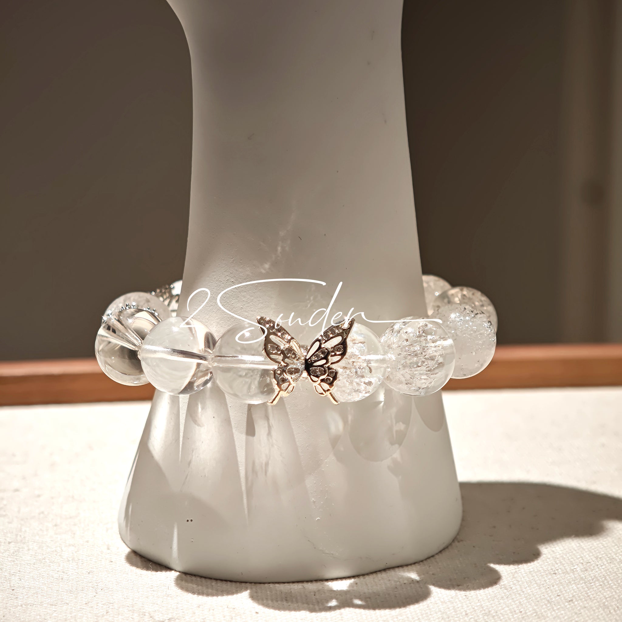 This is a crystal bracelet including white fireworks super seven clear quartzs, pure clear quartzs and raw clear quartz nuggets.