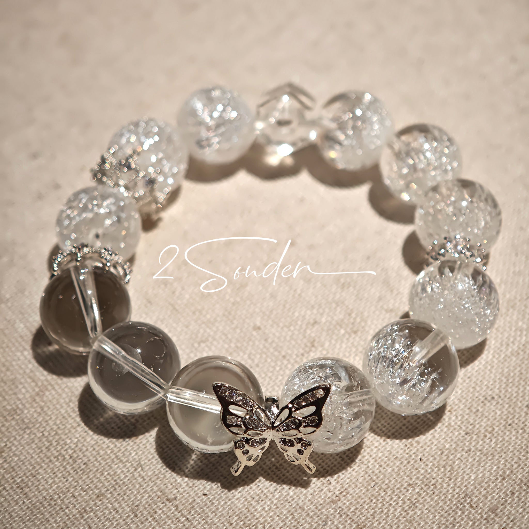 This is a crystal bracelet including white fireworks super seven clear quartzs, pure clear quartzs and raw clear quartz nuggets.