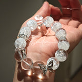 This is a crystal bracelet including white fireworks super seven clear quartzs, pure clear quartzs and raw clear quartz nuggets.