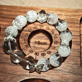 This is a crystal bracelet including white fireworks super seven clear quartzs, pure clear quartzs and raw clear quartz nuggets.
