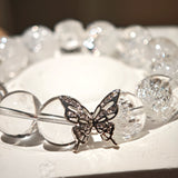 This is a crystal bracelet including white fireworks super seven clear quartzs, pure clear quartzs and raw clear quartz nuggets.