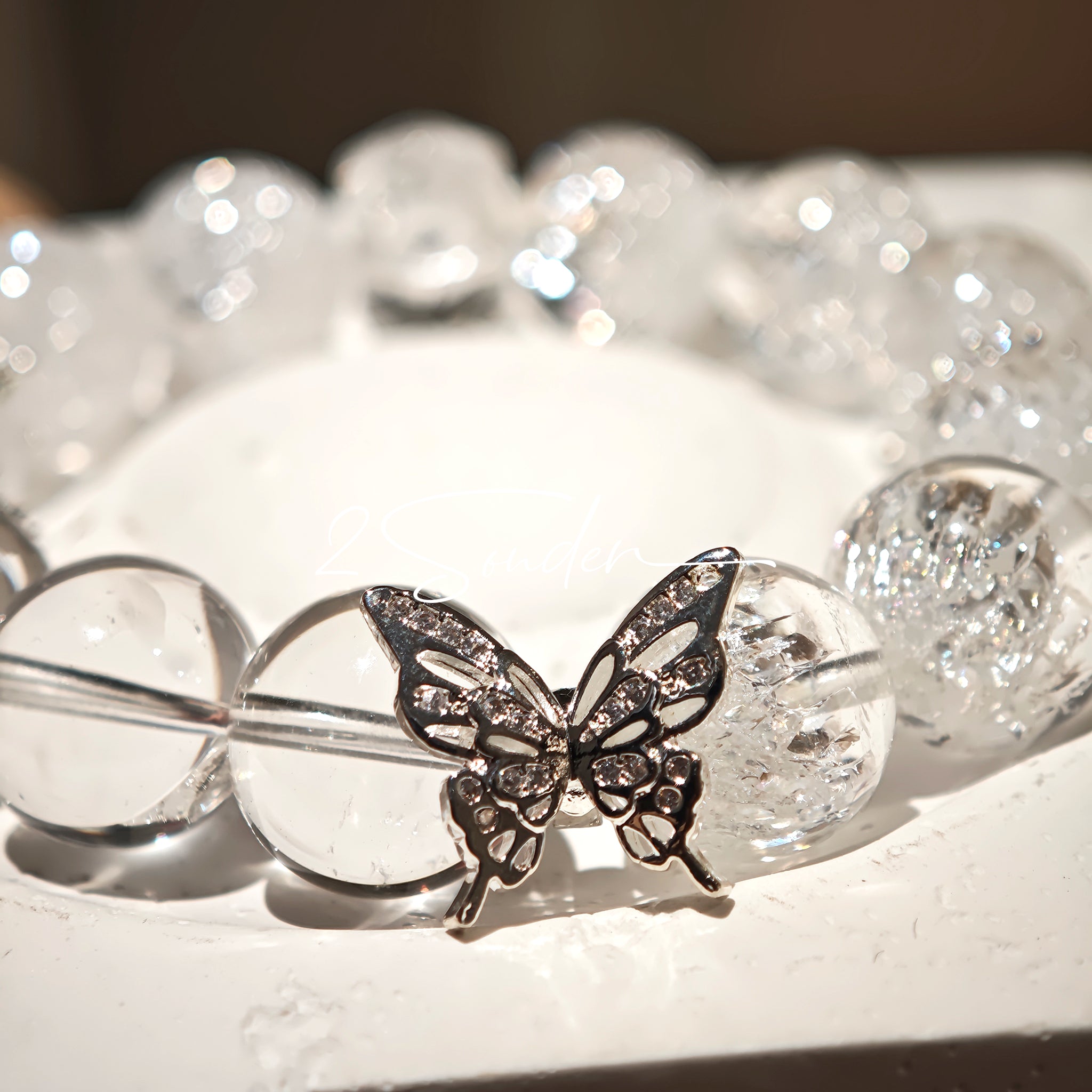This is a crystal bracelet including white fireworks super seven clear quartzs, pure clear quartzs and raw clear quartz nuggets.