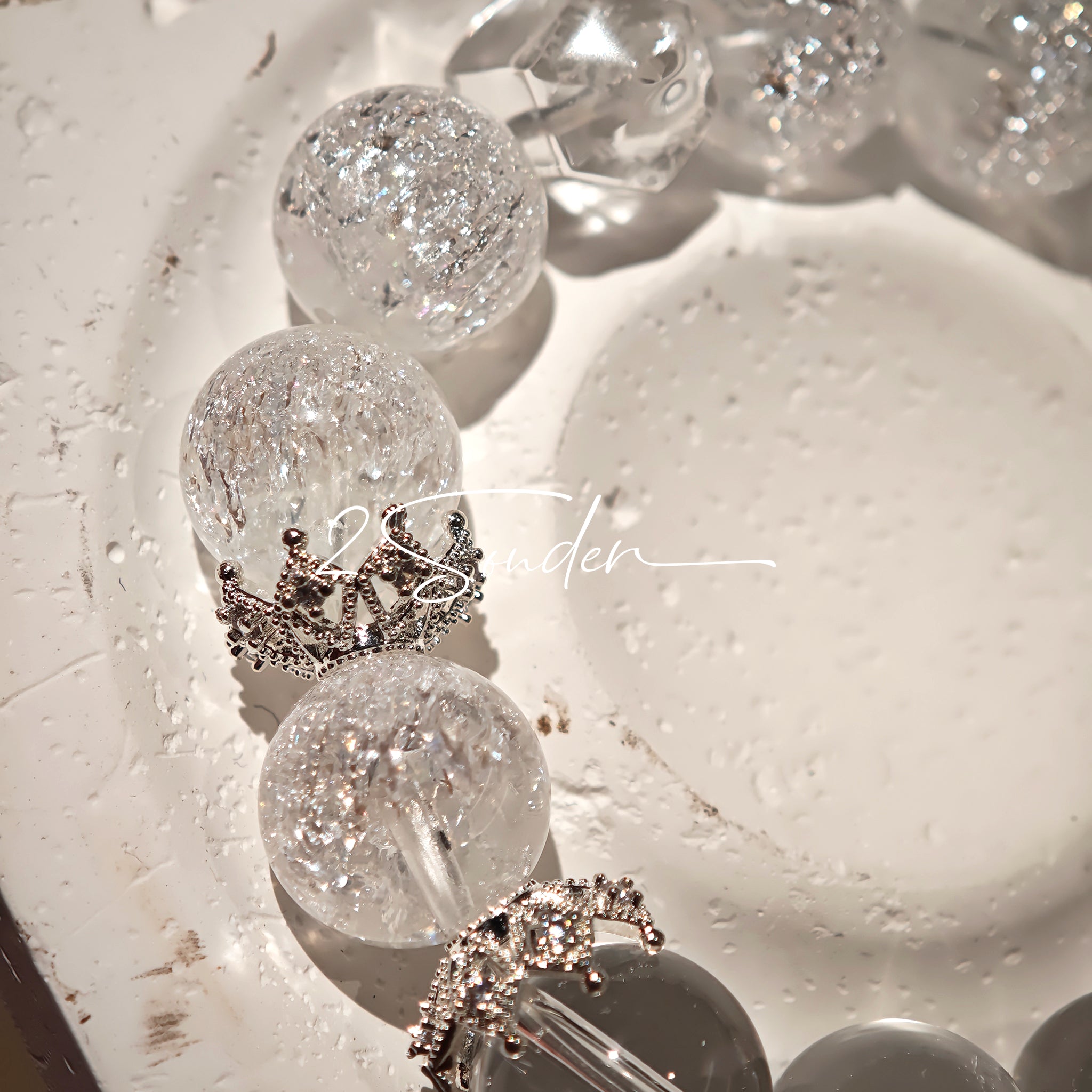 This is a crystal bracelet including white fireworks super seven clear quartzs, pure clear quartzs and raw clear quartz nuggets.