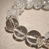 This is a crystal bracelet including white fireworks super seven clear quartzs, pure clear quartzs and raw clear quartz nuggets.