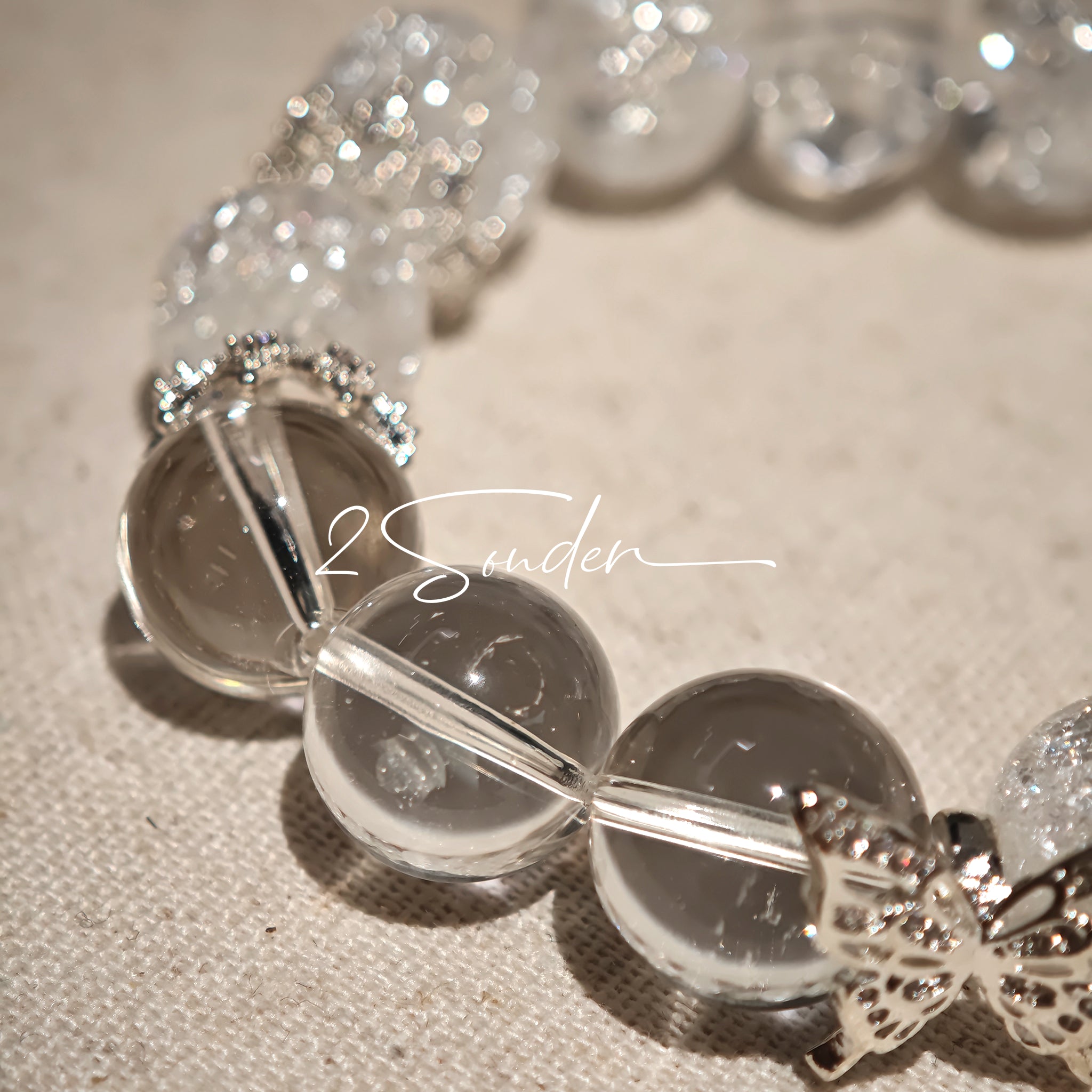 This is a crystal bracelet including white fireworks super seven clear quartzs, pure clear quartzs and raw clear quartz nuggets.