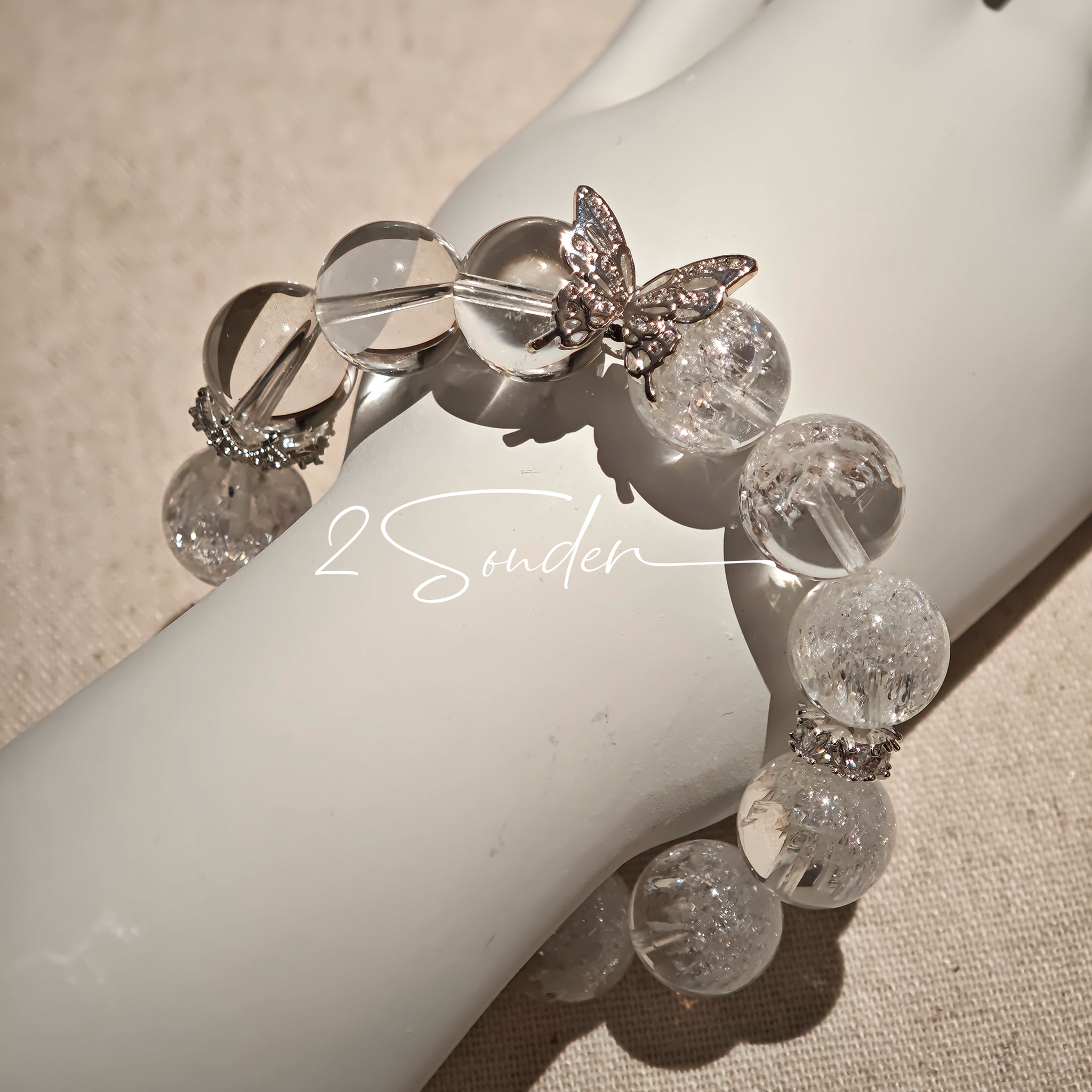 This is a crystal bracelet including white fireworks super seven clear quartzs, pure clear quartzs and raw clear quartz nuggets.