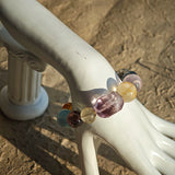 This is a rainbow energy bracelet that consists of Aquamarine, Amethyst, Clear Quartz, White Phantom Quartz, Citrine, Prehnite, Golden Healer, and Herkimer Diamond.