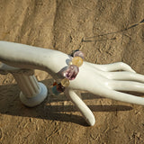 This is a rainbow energy bracelet that consists of Aquamarine, Amethyst, Clear Quartz, White Phantom Quartz, Citrine, Prehnite, Golden Healer, and Herkimer Diamond.
