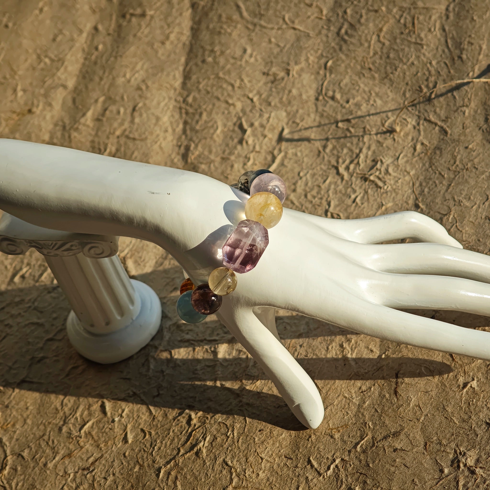 This is a rainbow energy bracelet that consists of Aquamarine, Amethyst, Clear Quartz, White Phantom Quartz, Citrine, Prehnite, Golden Healer, and Herkimer Diamond.