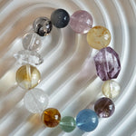 This is a rainbow energy bracelet that consists of Aquamarine, Amethyst, Clear Quartz, White Phantom Quartz, Citrine, Prehnite, Golden Healer, and Herkimer Diamond.