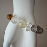 This is a rainbow energy bracelet that consists of Aquamarine, Amethyst, Clear Quartz, White Phantom Quartz, Citrine, Prehnite, Golden Healer, and Herkimer Diamond.