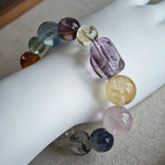 This is a rainbow energy bracelet that consists of Aquamarine, Amethyst, Clear Quartz, White Phantom Quartz, Citrine, Prehnite, Golden Healer, and Herkimer Diamond.